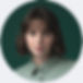 circular image of person facing the camera. The circle has a colored circle round it.